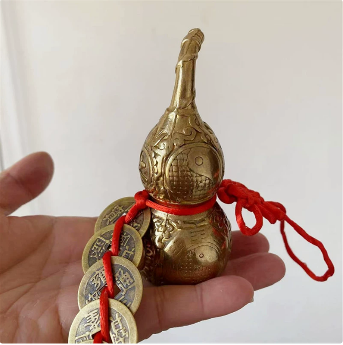 This translation reflects the specific elements mentioned, such as the material (pure copper), the feng shui item (gourd with five emperor coins), and the intended locations for placement (home, shop, living room, balcony, door-to-door).